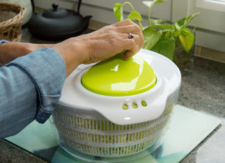 A woman and a salad spinner