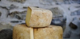 Three large blocks of gouda cheese