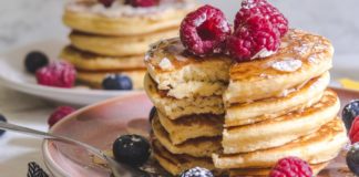 Stack of pancakes with raspberries