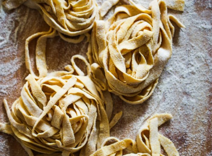 Uncooked pasta on a cooking sheet