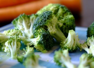 Broccoli pieces sprawled on a table