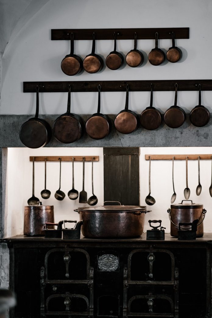 Old fashioned kitchen with copper pots