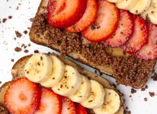 Peanut butter, banana, and strawberries on toast