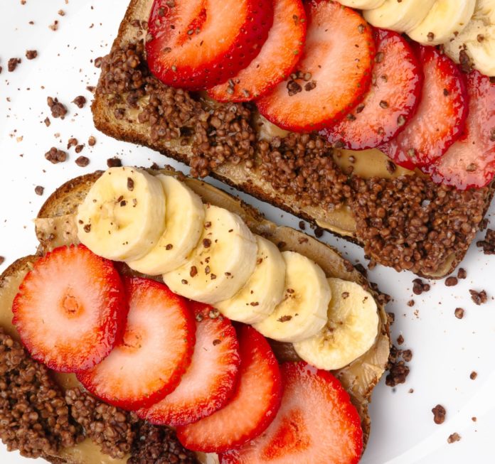 Peanut butter, banana, and strawberries on toast
