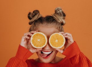 Girl smiling with citrus