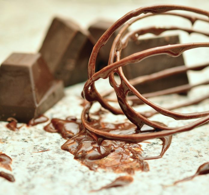 Chocolate mixture on whisk