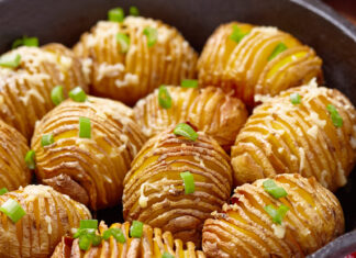 Baked hasselback potatoes with cheese and green onion