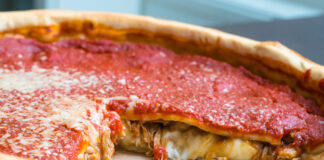 Top view of Chicago pizza. Chicago style deep dish italian cheese pizza with tomato sauce and beef meet inside
