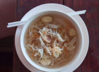 Bowl of cabbage soup with chop sticks