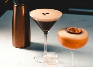 Espresso martini next to a NitroPress machine and another cocktail