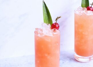 Paloma cocktail with cherry garnish