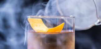 Whisky cocktail covered in smoke