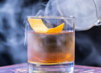 Whisky cocktail covered in smoke