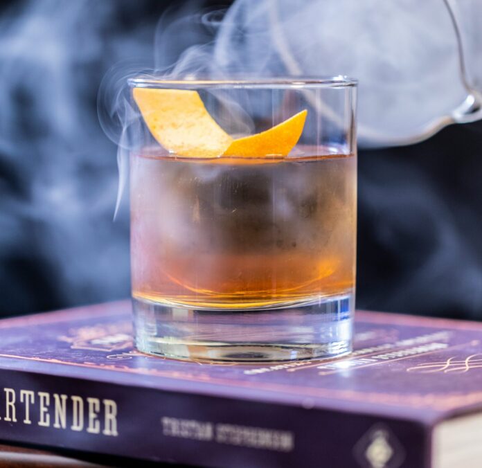 Whisky cocktail covered in smoke